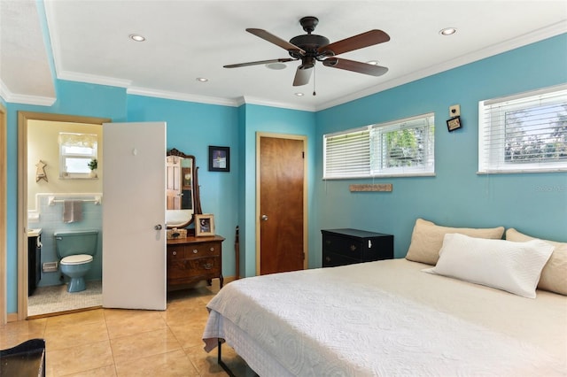 bedroom with ensuite bath, ceiling fan, crown molding, tile walls, and light tile patterned flooring