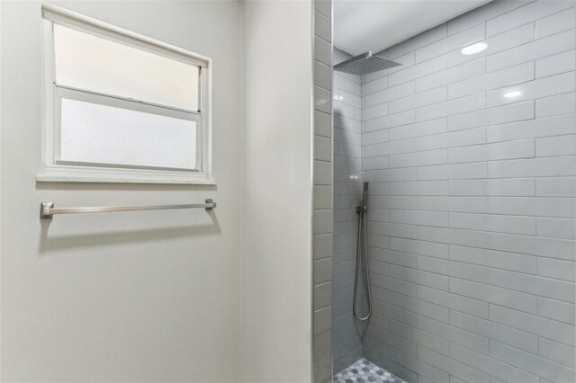 bathroom with a tile shower