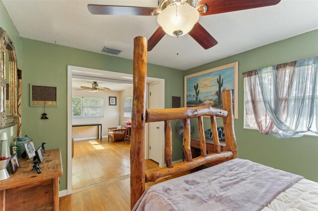 bedroom featuring ceiling fan and hardwood / wood-style floors