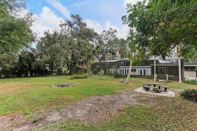 view of yard featuring glass enclosure