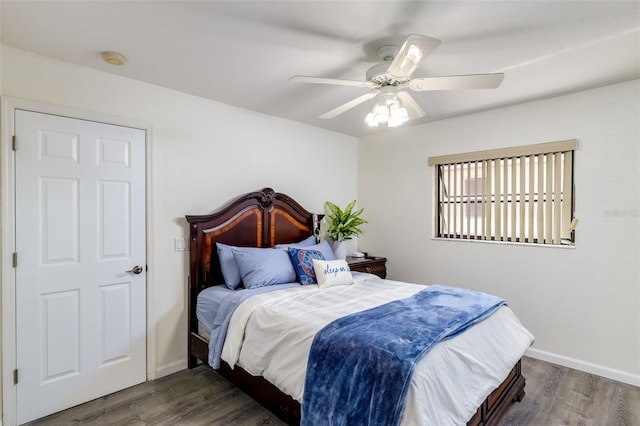 bedroom featuring dark hardwood / wood-style flooring and ceiling fan