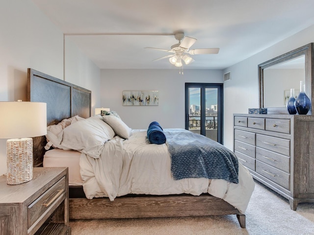 carpeted bedroom featuring ceiling fan and access to outside