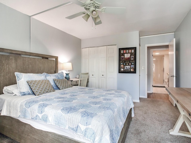 carpeted bedroom with ceiling fan and a closet