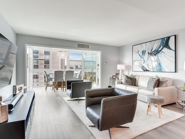 living room with light hardwood / wood-style flooring