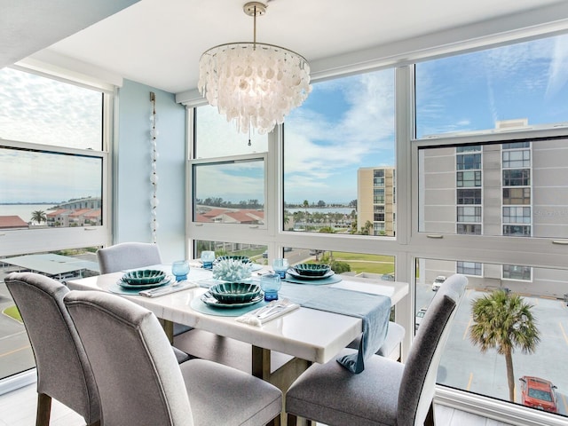 dining space with a notable chandelier