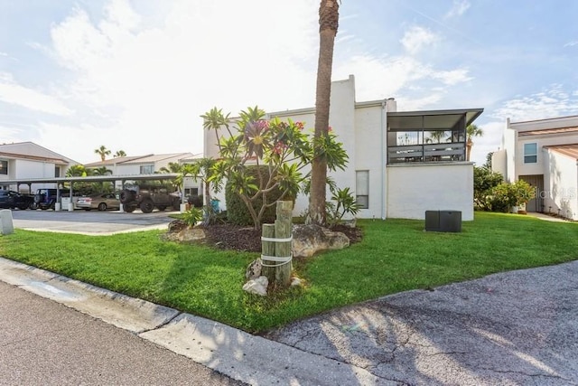 view of home's exterior featuring a lawn