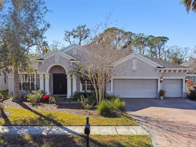 ranch-style home featuring a garage