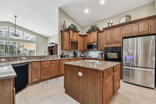 kitchen with sink, a kitchen island, black appliances, and vaulted ceiling