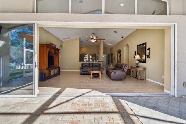 living room featuring high vaulted ceiling and ceiling fan