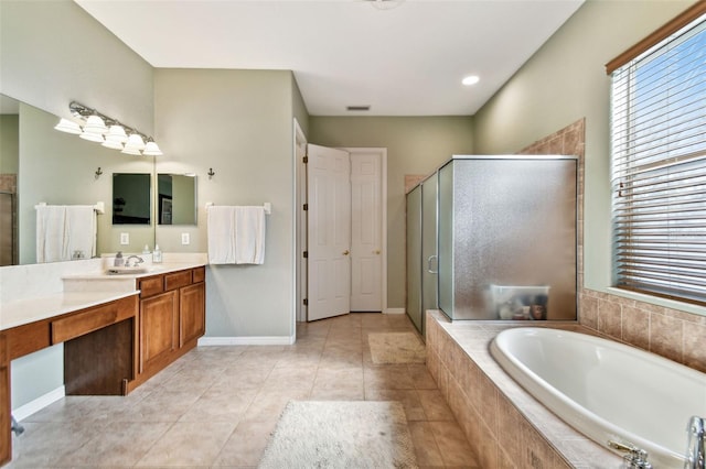 bathroom featuring tile patterned floors, vanity, and plus walk in shower