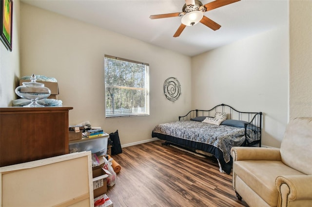 bedroom featuring hardwood / wood-style floors and ceiling fan