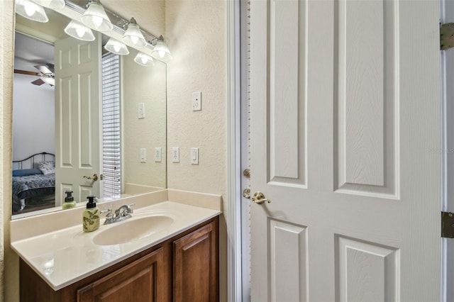 bathroom with vanity and ceiling fan