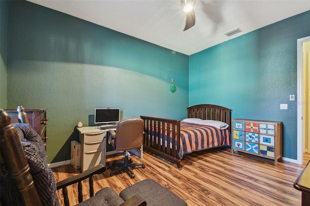 bedroom featuring ceiling fan and light hardwood / wood-style flooring