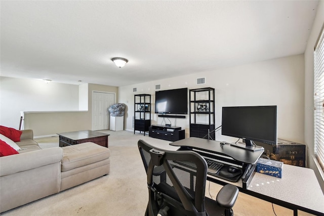 office area featuring light colored carpet