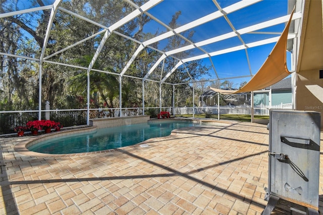 view of pool with a lanai and a patio area