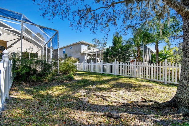 view of yard with a lanai