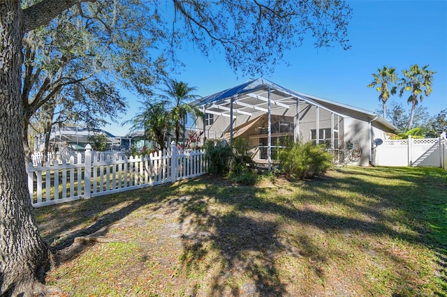 view of yard featuring a lanai