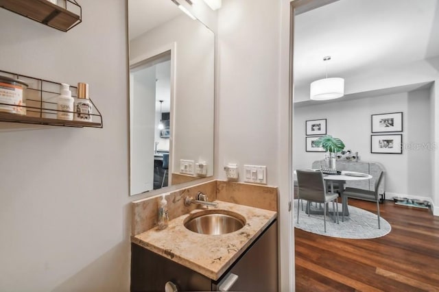 bathroom with vanity and wood-type flooring