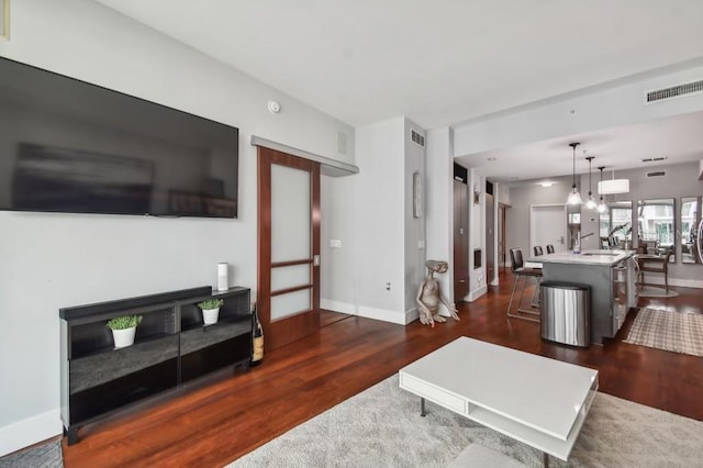 living room featuring dark hardwood / wood-style floors