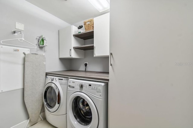 laundry room with cabinets and independent washer and dryer