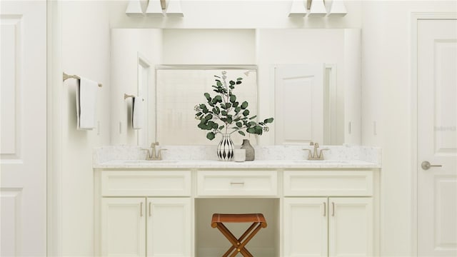 bathroom with vanity and a shower with shower door