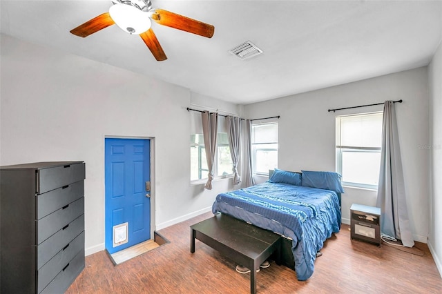 bedroom with ceiling fan and hardwood / wood-style floors