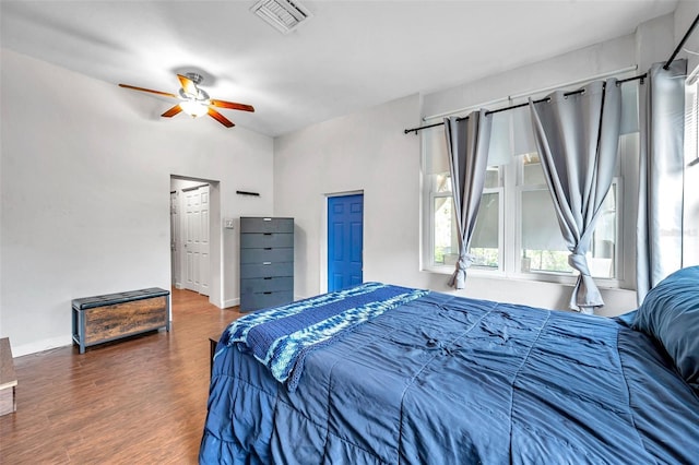 bedroom featuring ceiling fan and dark hardwood / wood-style flooring