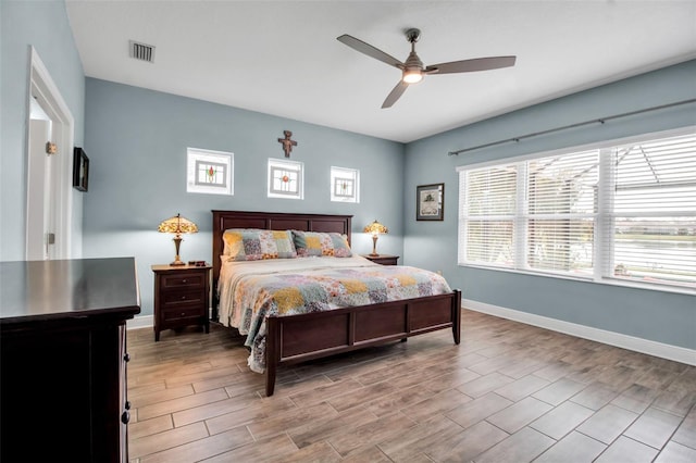 bedroom featuring ceiling fan and light hardwood / wood-style flooring