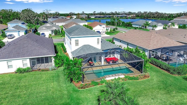 birds eye view of property with a water view