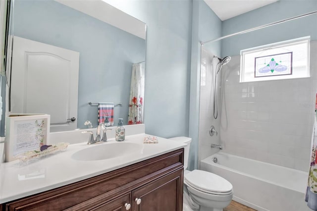 full bathroom with vanity, toilet, and shower / tub combo