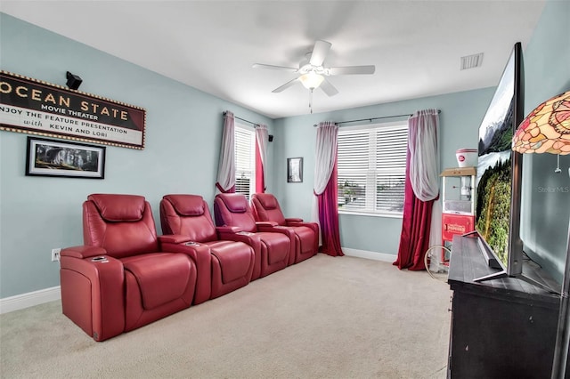 home theater with light carpet and ceiling fan