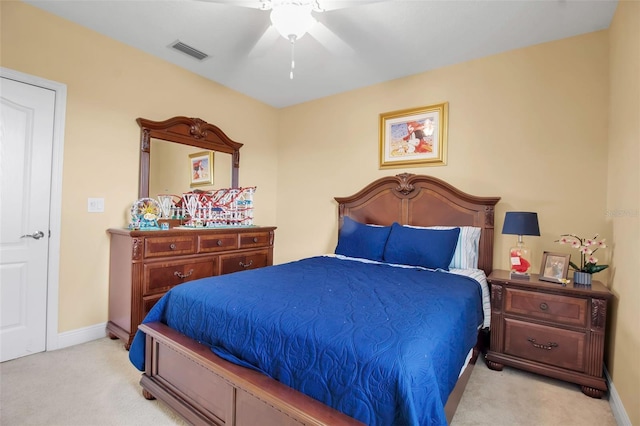 bedroom with ceiling fan and light colored carpet