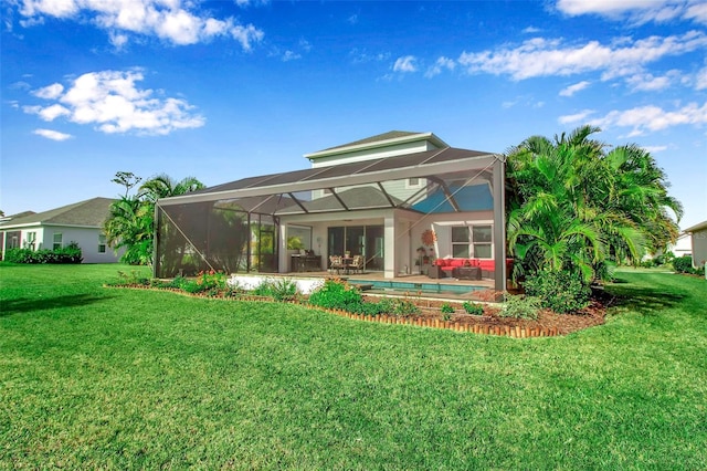 rear view of property featuring a yard and a lanai