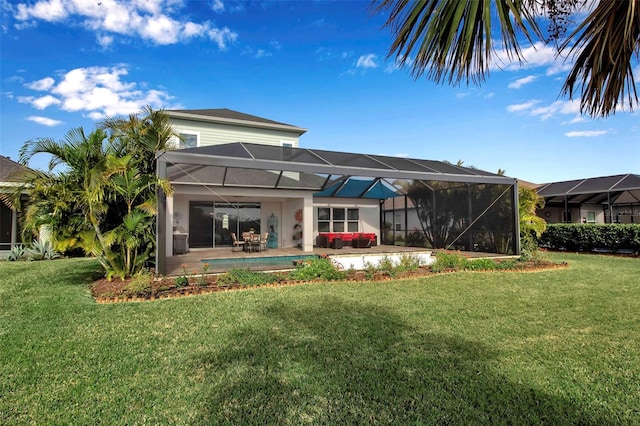 back of house featuring a swimming pool, a lanai, a patio area, and a lawn