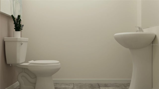 bathroom featuring tile patterned flooring and toilet