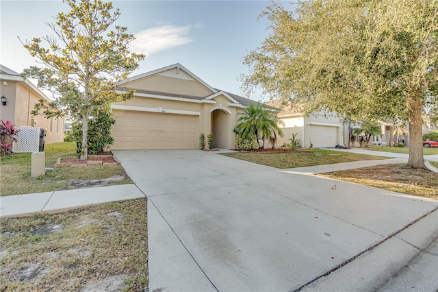 view of front facade featuring a front yard and a garage