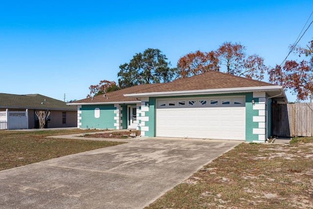 ranch-style house with a front yard and a garage