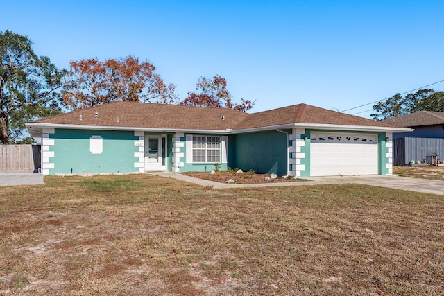 ranch-style home with a garage and a front lawn