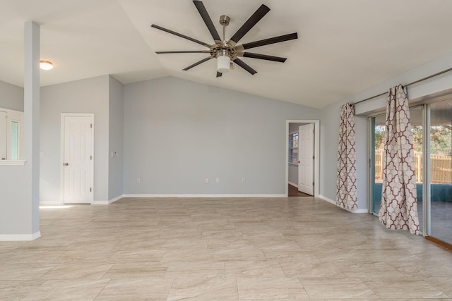 empty room with ceiling fan and lofted ceiling