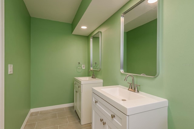 bathroom with tile patterned flooring and vanity