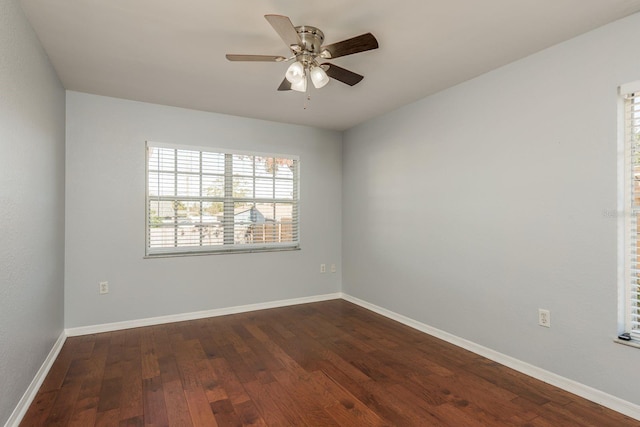 unfurnished room featuring dark hardwood / wood-style floors and ceiling fan