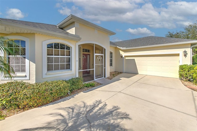 single story home featuring a garage