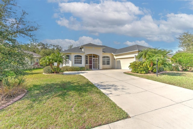 mediterranean / spanish-style house with a front yard and a garage