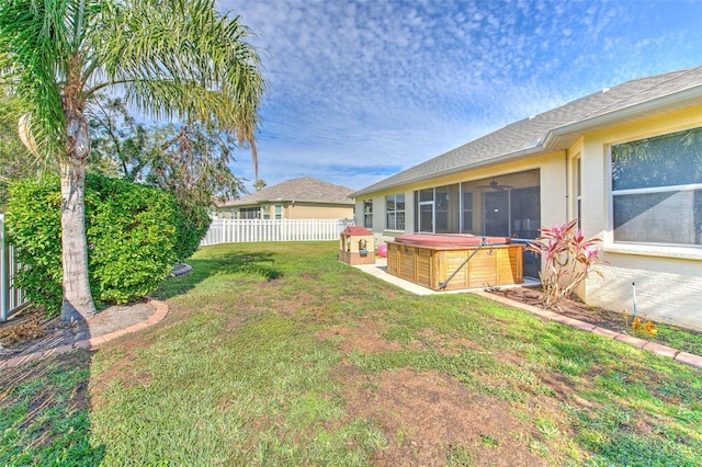 view of yard with a hot tub