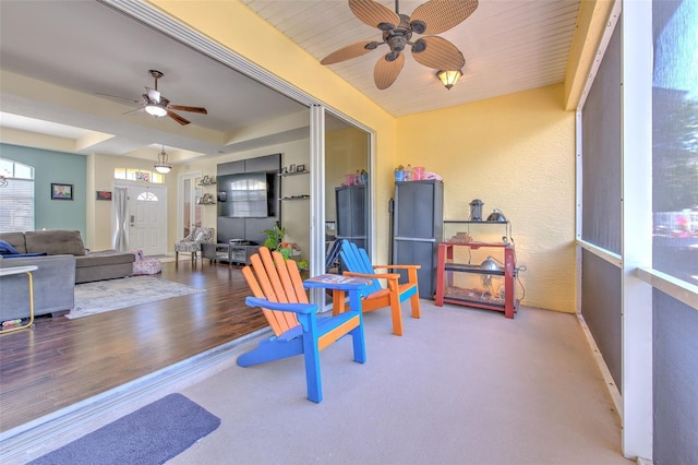 sunroom / solarium with ceiling fan