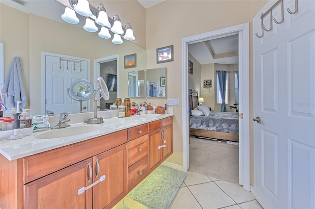 bathroom with tile patterned flooring and vanity