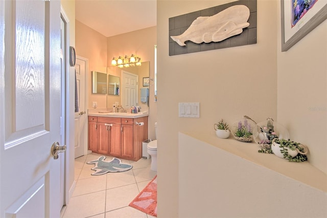 bathroom with tile patterned floors, vanity, and toilet