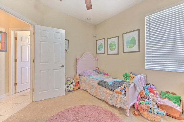 tiled bedroom with ceiling fan