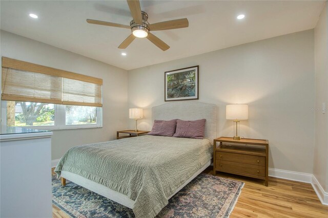 bedroom featuring ceiling fan and light hardwood / wood-style floors