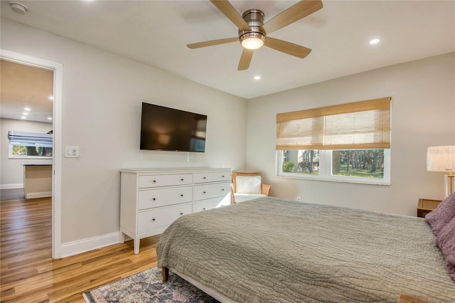 bedroom featuring ceiling fan and light hardwood / wood-style floors